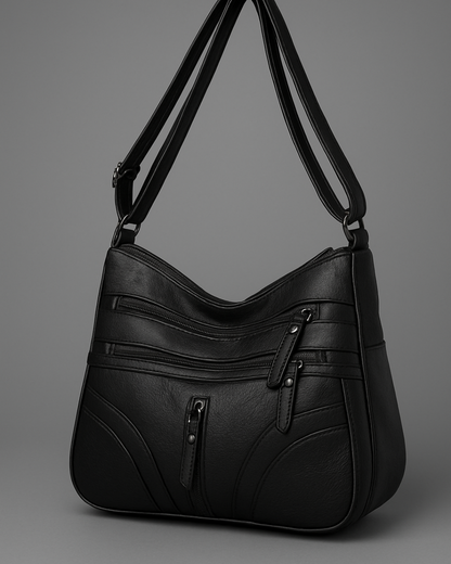 Bolso con múltiples compartimentos y textura suave